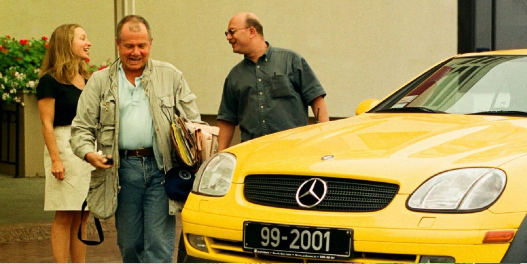 The yellow Mercedes of the 1999 Millennium Adventure, with its travellers beside it