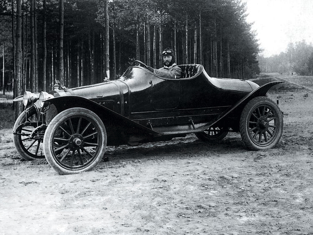 An early open touring car of the Russo-Balt era on a forest road, from the DARTZ heritage archive