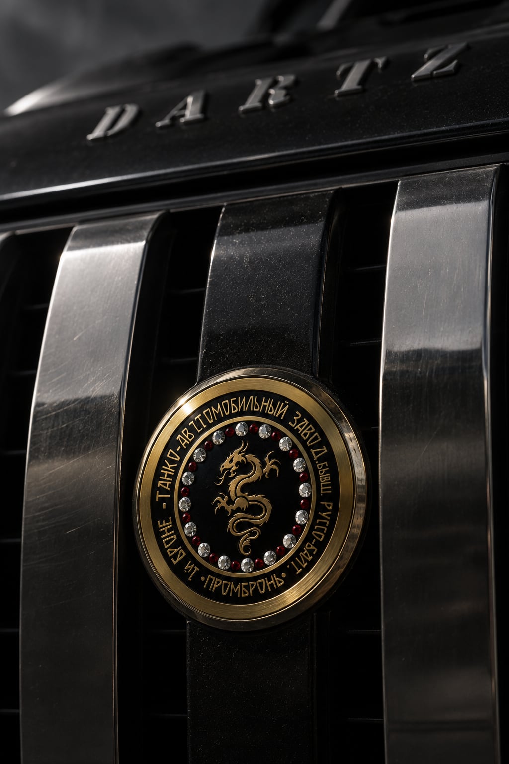 The jewelled dragon badge between the polished grille bars of the Black Dragon CLV