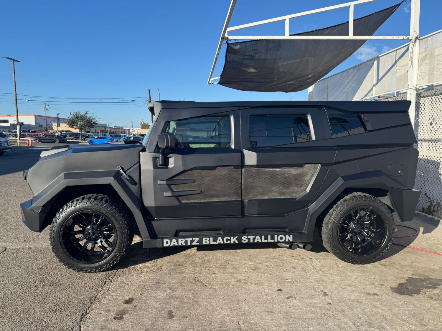 The DARTZ Black Stallion in profile in Los Angeles, with DARTZ BLACK STALLION on its sill