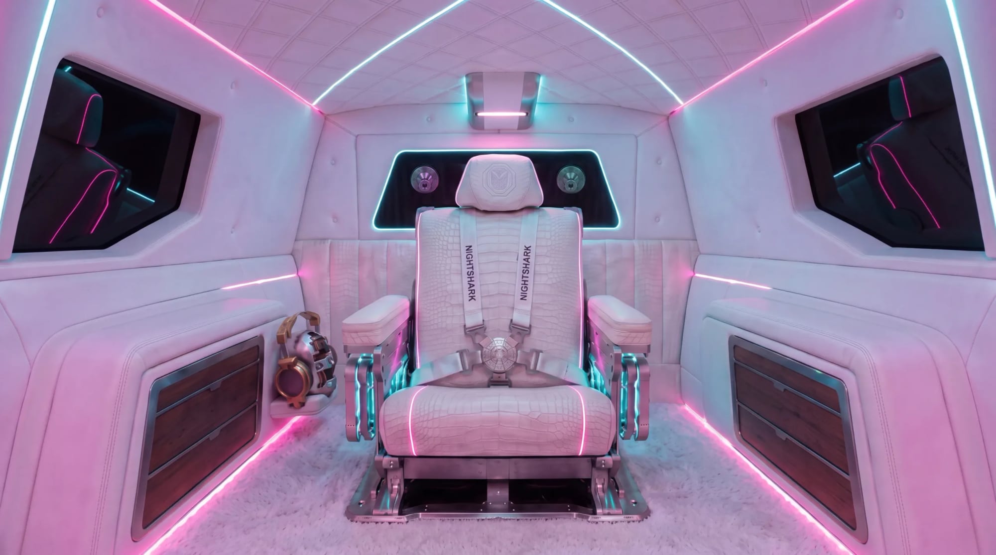The fighter-jet ejector seat at the heart of the DARTZ Nightshark VI, with its exposed rails and five-point harness, in gaming lighting