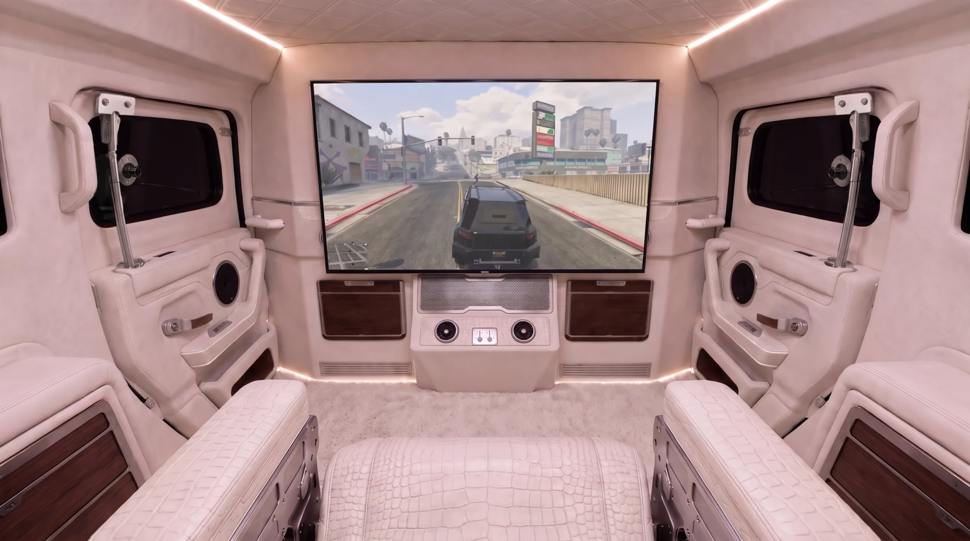 The rear cabin of the DARTZ Nightshark VI: a large screen between the rear doors, cream leather seating and wood trim