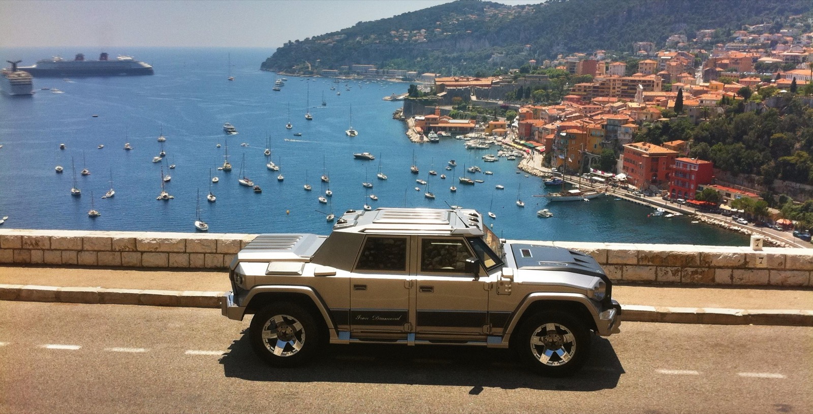 An original DARTZ Prombron’ Iron Diamond on a corniche road above a Riviera harbour